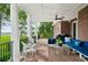 Relaxing covered back porch with comfortable seating and scenic views at 510 Traders Aly, Mount Pleasant, SC 29464