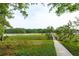 Picturesque backyard view with a wooden walkway extending over lush marshland and serene waters at 510 Traders Aly, Mount Pleasant, SC 29464