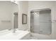 Clean bathroom with a white vanity, shower with sliding door, and neutral wall color at 510 Traders Aly, Mount Pleasant, SC 29464