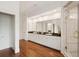 Spacious bathroom with double vanities, granite countertops, hardwood floors, and a luxurious walk-in shower at 510 Traders Aly, Mount Pleasant, SC 29464