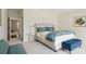 Bright bedroom featuring neutral walls, a comfortable upholstered bed, and stylish blue accents at 510 Traders Aly, Mount Pleasant, SC 29464