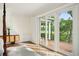 Bright bedroom featuring a sliding glass door providing access to an outdoor balcony with scenic marsh views at 510 Traders Aly, Mount Pleasant, SC 29464