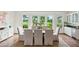 Bright dining room with marsh views, hardwood floors and elegant dining set at 510 Traders Aly, Mount Pleasant, SC 29464