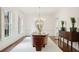 Bright dining room featuring hardwood floors, white wainscoting, and a modern chandelier at 510 Traders Aly, Mount Pleasant, SC 29464