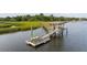 Waterfront dock with gazebo, kayak, and steps to access the water, surrounded by lush marshland at 510 Traders Aly, Mount Pleasant, SC 29464