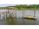 A yellow kayak sits on the edge of a dock with a gazebo that has chairs and tables for entertaining at 510 Traders Aly, Mount Pleasant, SC 29464