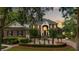 Stately brick home with a circular driveway, manicured landscaping, and a grand entrance at 510 Traders Aly, Mount Pleasant, SC 29464