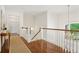 Bright hallway with hardwood floors, white walls and trim, staircase, and chandelier at 510 Traders Aly, Mount Pleasant, SC 29464