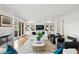 Bright living room featuring custom built-ins, fireplace, hardwood floors, and comfortable seating at 510 Traders Aly, Mount Pleasant, SC 29464