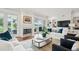 Bright living room featuring fireplace, hardwood floors, built-in shelving, and comfortable seating at 510 Traders Aly, Mount Pleasant, SC 29464