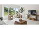 Inviting living room featuring wicker seating, a large window with scenic views, and neutral decor at 510 Traders Aly, Mount Pleasant, SC 29464