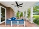 Spacious covered brick patio with outdoor seating and ceiling fans, perfect for entertaining at 510 Traders Aly, Mount Pleasant, SC 29464