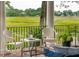 Outdoor patio with marsh views, white wicker furniture, and space for outdoor entertaining at 510 Traders Aly, Mount Pleasant, SC 29464