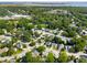An aerial view showcases a neighborhood surrounded by lush greenery and waterfront in the distance at 518 Cecilia Cove Dr, Charleston, SC 29412