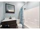 Stylish bathroom featuring a modern vanity and a shower-tub combo at 518 Cecilia Cove Dr, Charleston, SC 29412