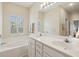 Beautiful bathroom featuring double sinks, ample counter space, and a soaking tub at 518 Cecilia Cove Dr, Charleston, SC 29412