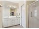 Bright bathroom featuring double sinks, ample cabinet space, and a glass shower enclosure at 518 Cecilia Cove Dr, Charleston, SC 29412