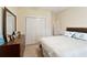 Bedroom featuring a wooden dresser, closet, and overhead lighting at 518 Cecilia Cove Dr, Charleston, SC 29412