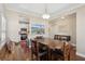 Open concept dining room with a dark table and view to the kitchen at 518 Cecilia Cove Dr, Charleston, SC 29412