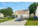 Charming single-Gathering home featuring a two-car garage, well-kept lawn, and an asphalt driveway at 518 Cecilia Cove Dr, Charleston, SC 29412