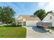 Inviting single-Gathering home with a well-manicured lawn, an asphalt driveway, and a one-car garage at 518 Cecilia Cove Dr, Charleston, SC 29412