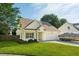 Charming single-Gathering home featuring a two-car garage, well-kept lawn, and an asphalt driveway at 518 Cecilia Cove Dr, Charleston, SC 29412