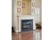 Close up view of the fireplace with a white mantel and black hearth at 518 Cecilia Cove Dr, Charleston, SC 29412