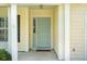 Beautiful light blue front door, with white trim and siding with a small window on the side at 518 Cecilia Cove Dr, Charleston, SC 29412