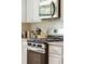 Close up of modern kitchen with stainless steel oven, microwave, and granite countertops at 518 Cecilia Cove Dr, Charleston, SC 29412