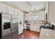 Spacious kitchen with stainless steel appliances, granite countertops and beautiful wood floors at 518 Cecilia Cove Dr, Charleston, SC 29412