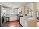 Modern kitchen featuring white cabinets, stainless steel appliances, granite countertops, and wood floors at 518 Cecilia Cove Dr, Charleston, SC 29412