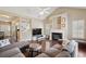 Bright living room featuring a fireplace and providing open access to the kitchen at 518 Cecilia Cove Dr, Charleston, SC 29412
