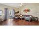 Spacious living room with hardwood floors, a sectional sofa, and sliding glass doors at 518 Cecilia Cove Dr, Charleston, SC 29412