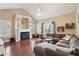 Cozy living room with a fireplace, vaulted ceiling, and comfortable seating area at 518 Cecilia Cove Dr, Charleston, SC 29412