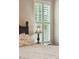 Relaxing main bedroom featuring plantation shutters and a decorative bedside lamp at 518 Cecilia Cove Dr, Charleston, SC 29412