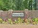 Landscaped entrance to Watson Hill community with brick fencing and signage at 5306 Bending Flats Way, Summerville, SC 29485