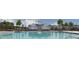 Community pool area featuring a clubhouse, palm trees, and outdoor seating at 5306 Bending Flats Way, Summerville, SC 29485