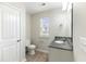 Bathroom featuring a granite countertop, toilet and a door to the left at 540 Truman Dr, Goose Creek, SC 29445