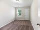 Bedroom with neutral walls and carpet, a window and a door at 540 Truman Dr, Goose Creek, SC 29445