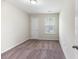 Bedroom with neutral walls and carpet, a window and a door at 540 Truman Dr, Goose Creek, SC 29445