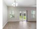 Cozy dining area with modern floors, chandelier, and sliding door to patio at 540 Truman Dr, Goose Creek, SC 29445