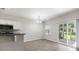 Cozy dining area with modern floors, chandelier, and sliding door to patio at 540 Truman Dr, Goose Creek, SC 29445