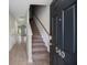 Inviting entryway with wood-look floors, staircase, and stylish front door at 540 Truman Dr, Goose Creek, SC 29445