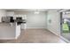 Eat-in kitchen with white cabinets, modern floors, and stainless steel appliances at 540 Truman Dr, Goose Creek, SC 29445