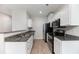 Modern kitchen featuring granite counters, stainless appliances, and white cabinets at 540 Truman Dr, Goose Creek, SC 29445