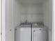 Convenient laundry closet includes a white, front-loading washer and dryer for easy chore completion at 540 Truman Dr, Goose Creek, SC 29445