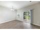 Bright living room with modern floors and sliding glass door to screened patio at 540 Truman Dr, Goose Creek, SC 29445