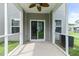 Cozy screened-in porch with a fan and siding, offering a perfect spot to relax in comfort at 540 Truman Dr, Goose Creek, SC 29445