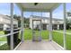 Enjoy outdoor living on this screened-in porch with views of the lawn, perfect for relaxing or entertaining at 540 Truman Dr, Goose Creek, SC 29445