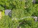 Aerial view of home featuring lush greenery and a driveway leading to the residence at 5710 Barbary Coast Rd, Hollywood, SC 29449